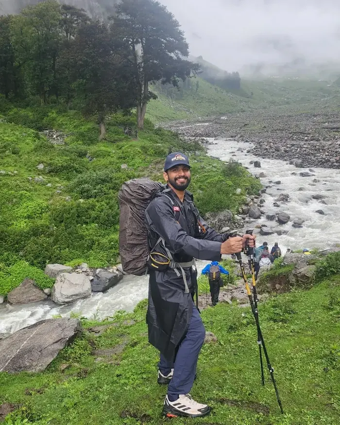 Trekking in the Himalayas beside a glacial river